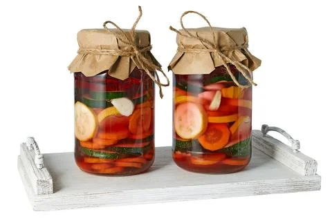 Two jars with salted fermented vegetables decorated with craft paper and tw.. Stock Photos