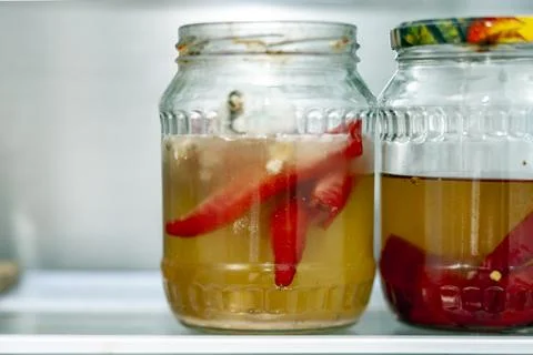 Two jars with spoiled vegetables Fotos Stock