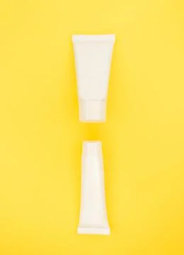 Two jars of white without inscriptions on a beautiful background. Stock Photos