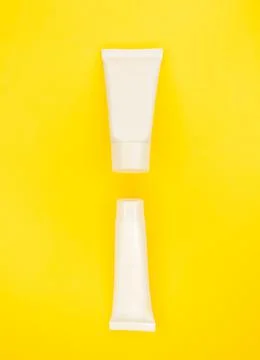 Two jars of white without inscriptions on a beautiful background. Stock Photos