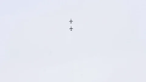 Two jet planes of Royal Saudi Air Force aerobatic team Saudi Hawks flying Stock Footage 114520358