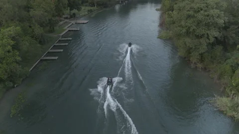 Two jet skis create a wake in the river Stock Footage 323463124