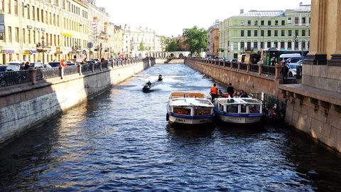 Two jet skis float on the Griboyedov Canal in the city center Stock Footage 72474555