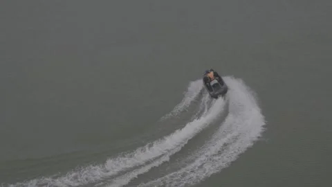 Two Jet Skis Racing Side By Side With White Wakes On Gan River Stock-Footage 343546849