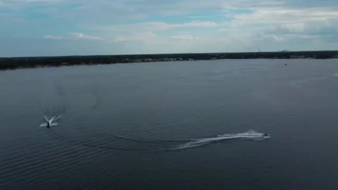 Two Jet Ski’s speeding across a Central Florida lake Stock Footage 239488646