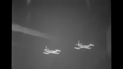 Two jets flying high up in the sky Stock Footage 36425488