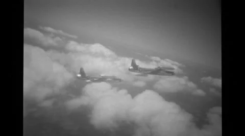 Two jets flying high up in the sky Stock Footage 36426703