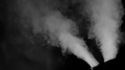 TWO JETS OF STEAM WITH NEGATIVE SPACE.  IN 4K, 10 BIT. Stock Footage 104579528