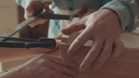 Two Joiners Fastening Planks Together Using Carpentry Instrument Stock Footage 154577091