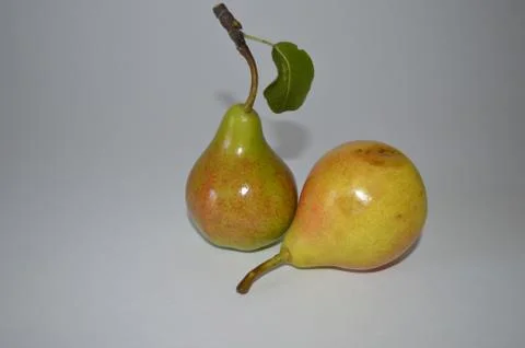 Two juicy pears on a light background Foto stock