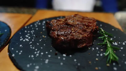 Two juicy steaks on a platter. Stock Footage 145855869