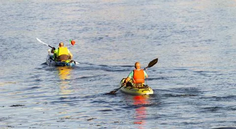 Two Kayakers Rowing on River Stock Photos