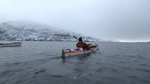 Two kayakers sailing on the Arctic Ocean, Greenland Stock Footage 104181798