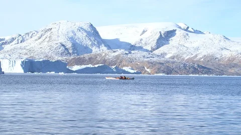 Two kayakers sailing on the Arctic Ocean, Greenland Stock Footage 104187651