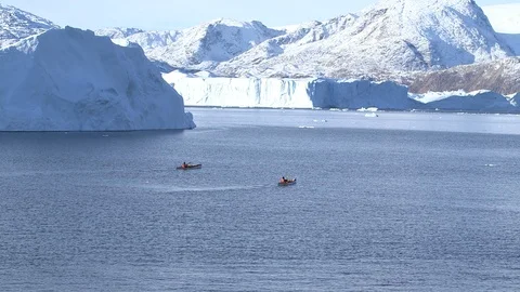 Two kayakers sailing on the Arctic Ocean, Greenland Stock-Footage 104188460