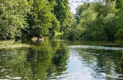 Two kayaks float peacefully on the River Lea near Enfield Lock Stock Photos
