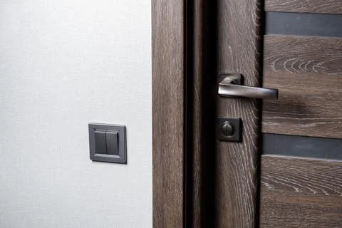 Two-key switch of gray color near the door, plastic mechanical switch. The li 写真素材
