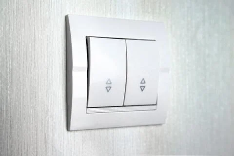 Two-key switch gray on the wall a plastic mechanical switch. Light switch ins Foto stock