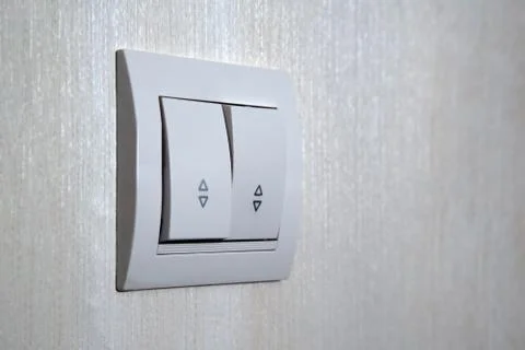 Two-key switch gray on the wall a plastic mechanical switch. Light switch ins Stock Photos