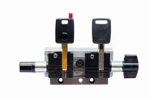 Two keys in a key copying machine key holder Stock Photos