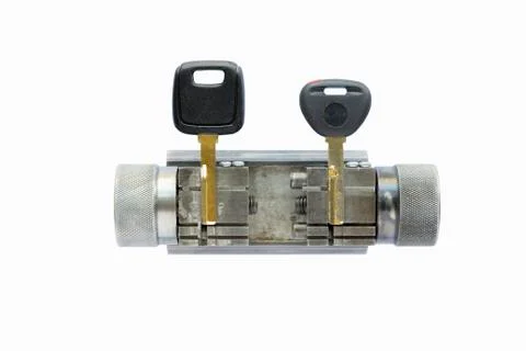 Two keys in a key copying machine key holder Stock Photos