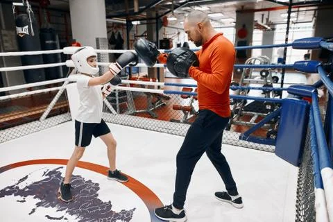 Two kickboxers sparring in the ring Stock Photos