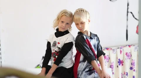 Two kid girls posing during photo shooting session Stock Footage 56256290
