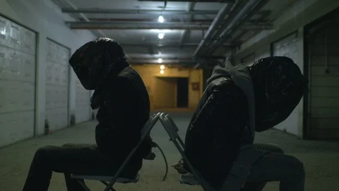 Two kidnapped men in mafia hideout Stock Footage 114065302