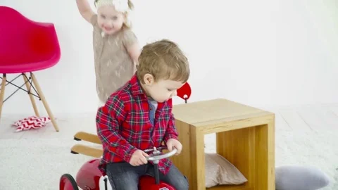 Two kids are having fun in the room Stock Footage 75015803
