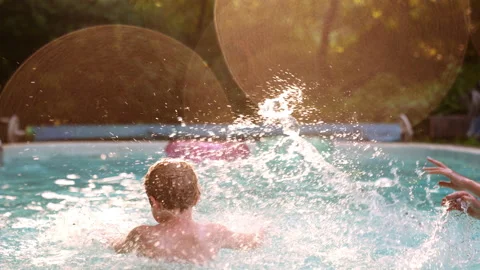 Two Kids Boy and Girl Having Fun in the Pool. Summer Vacation Concept 動画素材 200335953