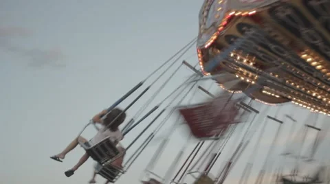 Two kids in a carousel Stock Footage 46896336