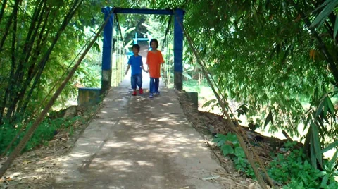 Two Kids Crossing The Bridge Video stock 37272572