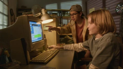 Two Kids Drawing Pictures using Computer in 90s Stock Footage 304864828