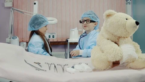 Two kids dressed as doctors talk Video stock 85794221