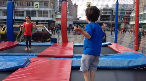Two kids jump on a trampolin Stock Footage 41724319
