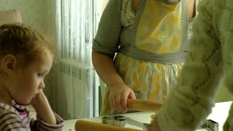 Two kids kneading the dough for make cookies together Video stock 84803433