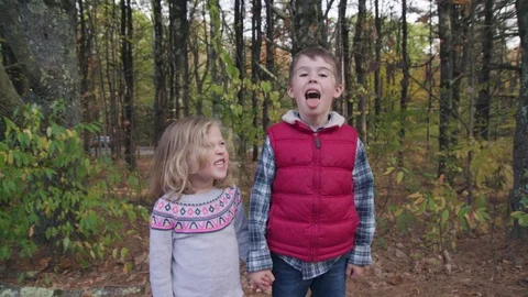 Two kids make silly faces to camera Stock Footage 81525554