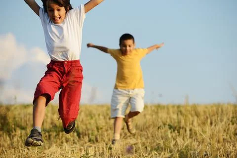Two kids on meadow 스톡 사진