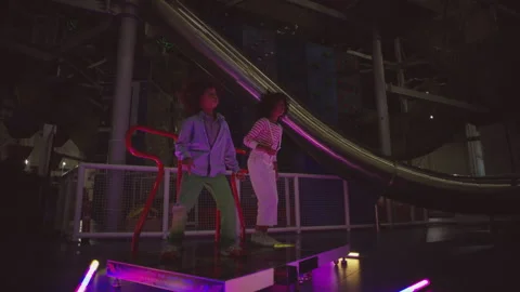 Two kids playing dance and jump game Stock Footage 283265318