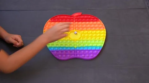Two kids playing with pop it. Stock Footage 159610993
