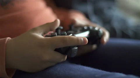 Two kids playing video games. Close Up of hands with controller 스톡 동영상 62653679