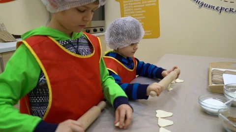Two kids preparing cookies in the kitchen. Stock Footage 85896089