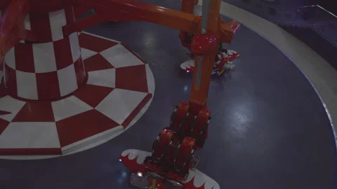 Two Kids ready to get aboard flying planes in the amusement park Stock Footage 283284289