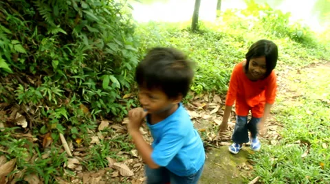 Two Kids Running in The Forest Stock Footage 37227669