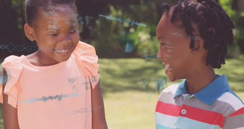 Two kids smiling on lawn as waveform lines and code blocks emerging across faces Stock Footage 330981093