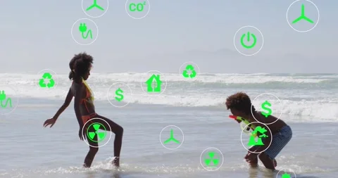 Two kids splashing surf, waves sparking floating energy icons promoting cleaner Stock Footage 330160720
