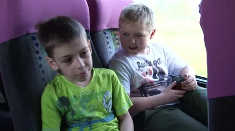 two-kids-talking-tour-bus-footage-055965880_iconl.jpeg