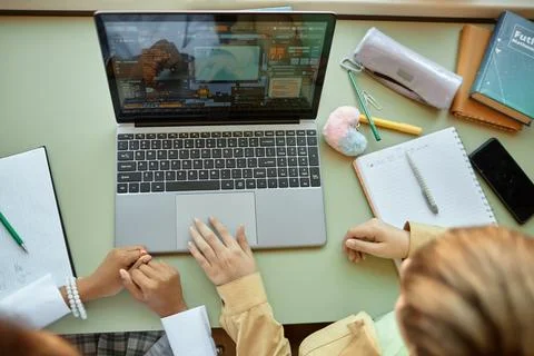 Two Kids Using Laptop Studying in Class Desk with Stationery Stockfoto's