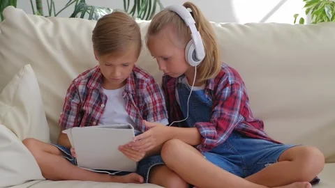 Two kids Using Tablet Computer Stock Footage 306220907
