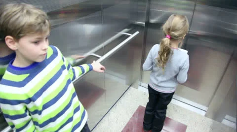 Two kids walk out from elevator when its arrived 스톡 동영상 22734299